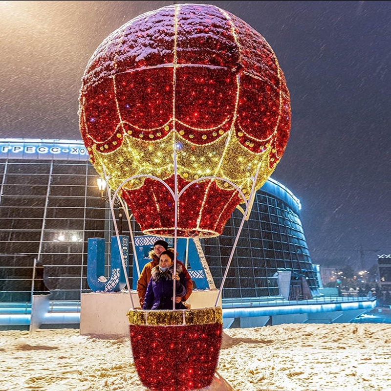 Large festive hot-air-balloon feature installed in a mall atrium