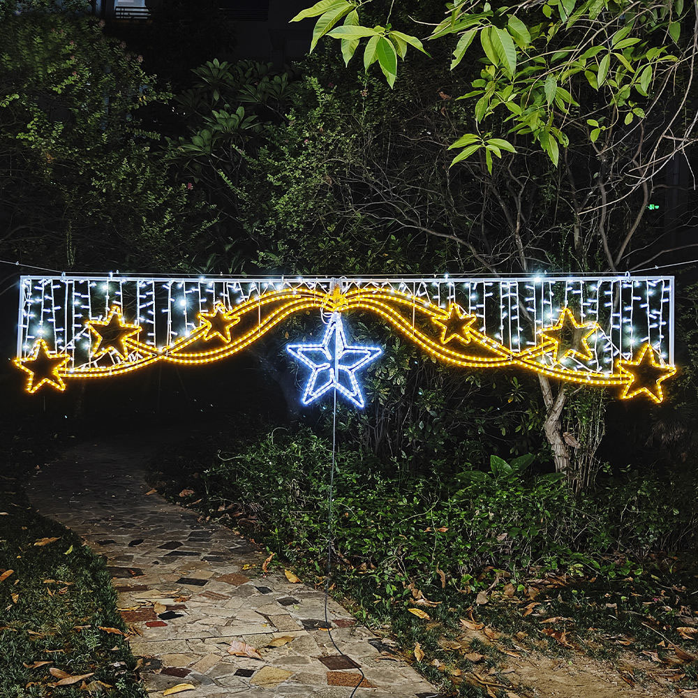 Illuminated star cross motif photographed after installation